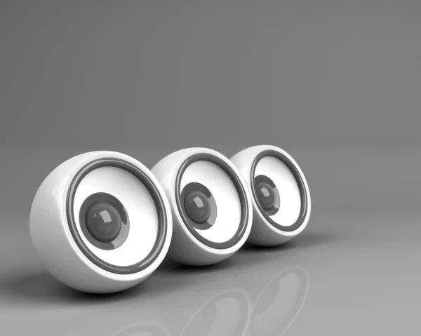 Trois haut-parleurs blancs sur fond gris — Photo