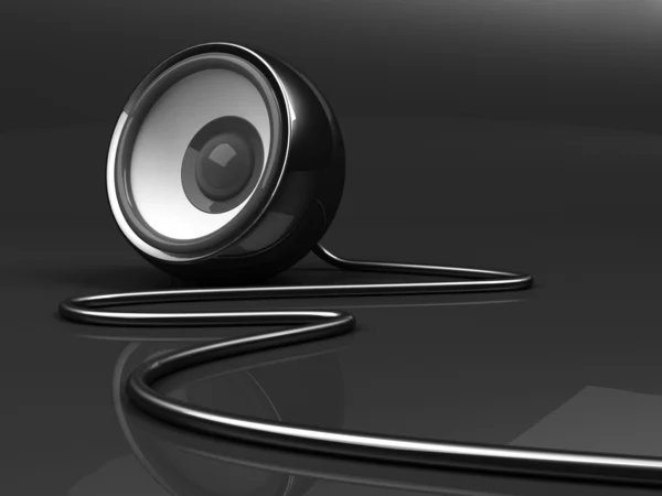 Black speaker with cable over grey background — Stock Photo, Image