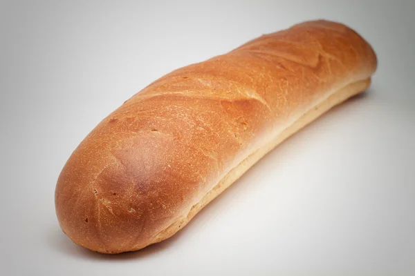 Bochník chleba na šedém pozadí — Stock fotografie