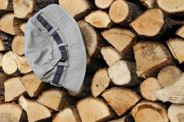 Stack of Firewood and Hat — Stock Photo, Image