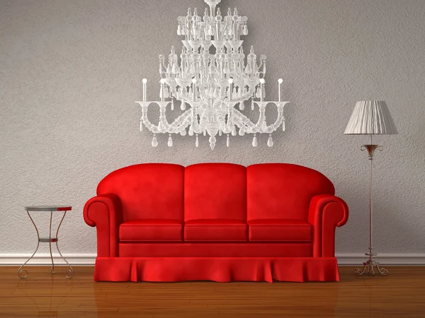 Czerwona sofa z tabeli i stoją lampy z żyrandola — Zdjęcie stockowe
