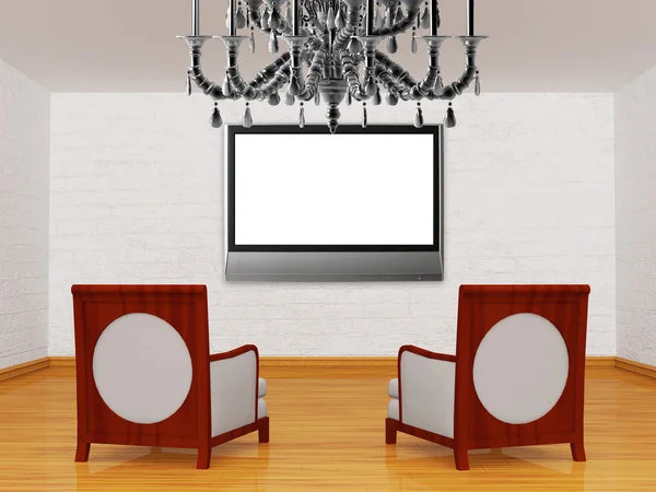 Två lyxiga stolar med lcd-tv och ljuskrona i Galleri — Stockfoto