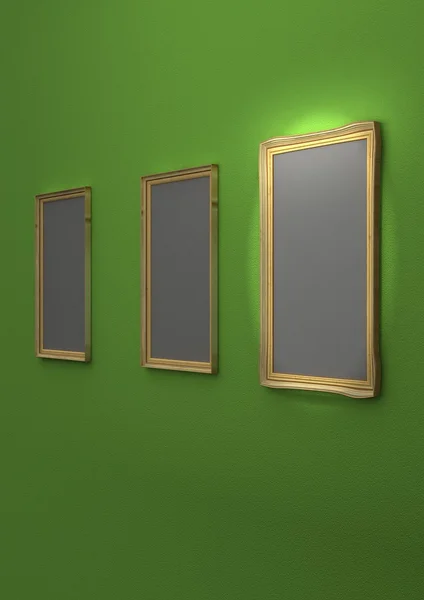 Gyllene tavelramar på grön vägg — Stockfoto