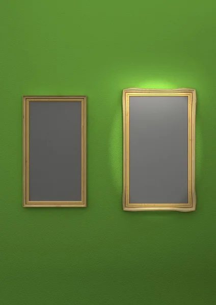 Gyllene tavelramar på grön vägg — Stockfoto