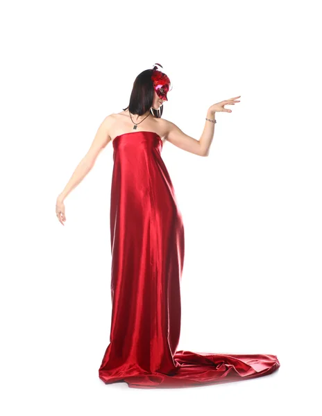 Γυναίκα που φοράει κόκκινο φόρεμα και μια μάσκα — Φωτογραφία Αρχείου