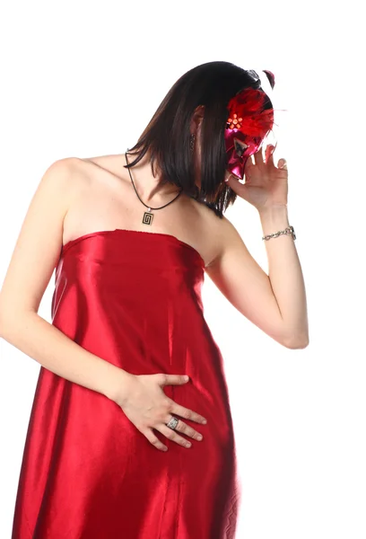 Kobieta ubrana w czerwony strój i maskę — Zdjęcie stockowe