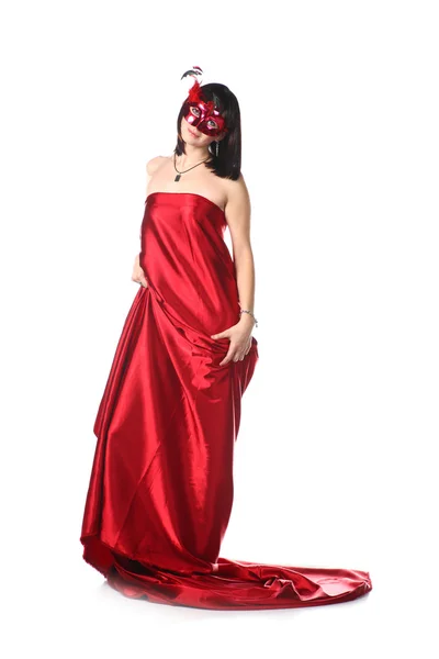 Vrouw rode jurk en een masker dragen — Stockfoto