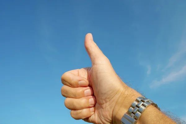 stock image This my hand on blue sky