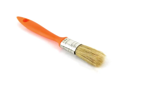 Кисть с оранжевой ручкой — стоковое фото