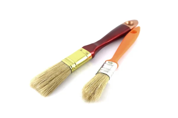 Кисть с коричневыми и оранжевыми ручками — стоковое фото