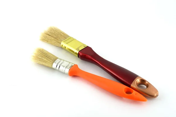 Pincel de pintura com alças marrom e laranja — Fotografia de Stock