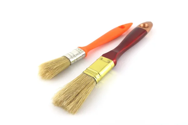 Pincel de pintura com alças marrom e laranja — Fotografia de Stock