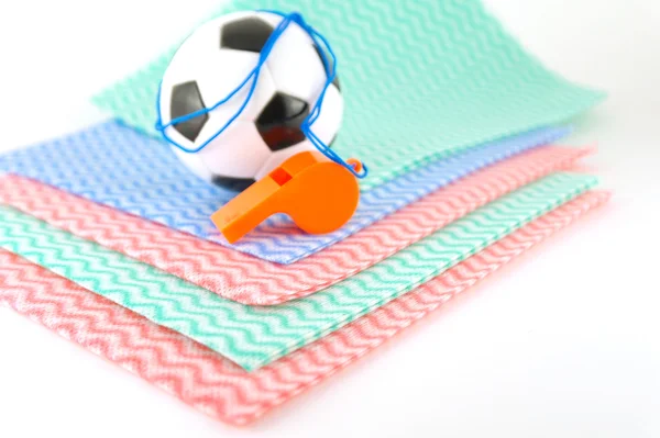 Football and whistle on the color napkins — Stock Photo, Image