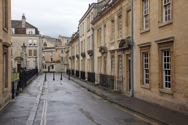 Old street in Bath, England with its typical Georgian architectu clipart