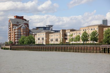 London, warehouse converted into apartments on the Thames in Lon clipart