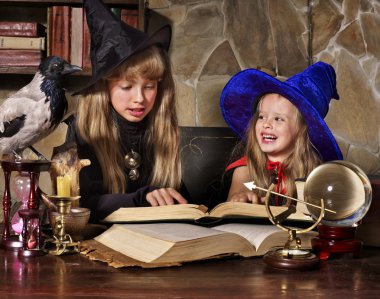 Witch kid with crystal ball. clipart