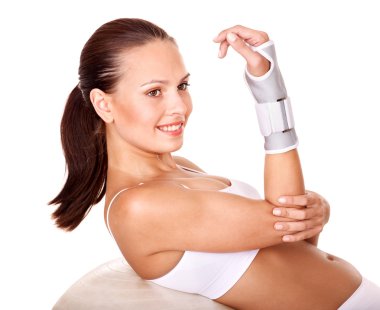 Woman with wrist brace. clipart