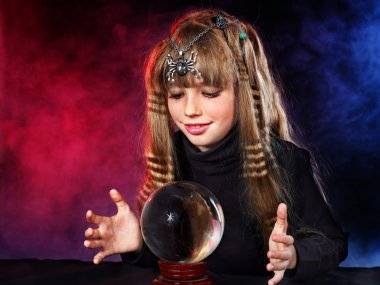 Child holding crystal ball. clipart