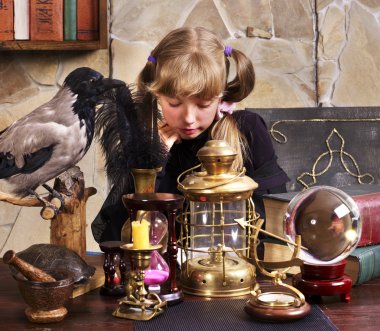 Witch kid with crystal ball. clipart