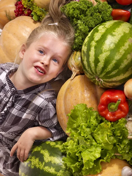 Child with vegetable on kitchen. — Stock Photo, Image