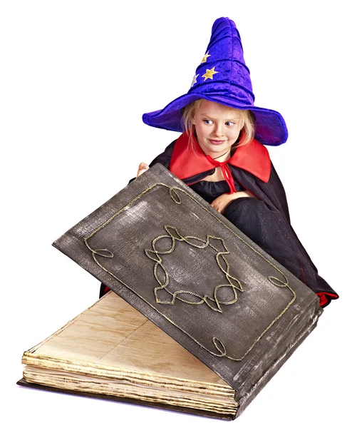 Witch child holding book. — Stock Photo, Image