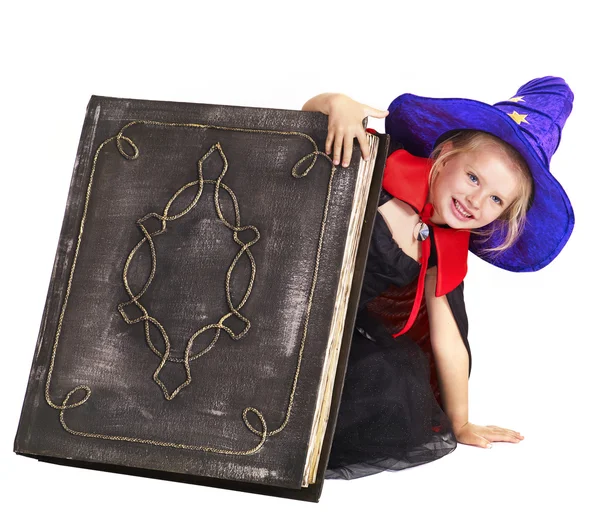 Witch child holding book. — Stock Photo, Image