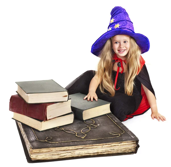 Witch child with stack book. — Stock Photo, Image