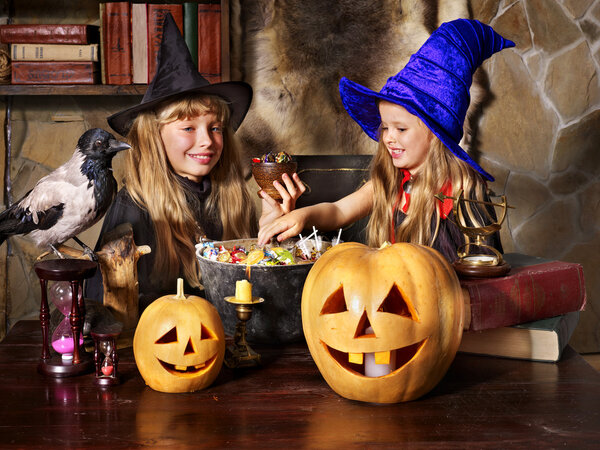 Witch with pumpkin lantern.
