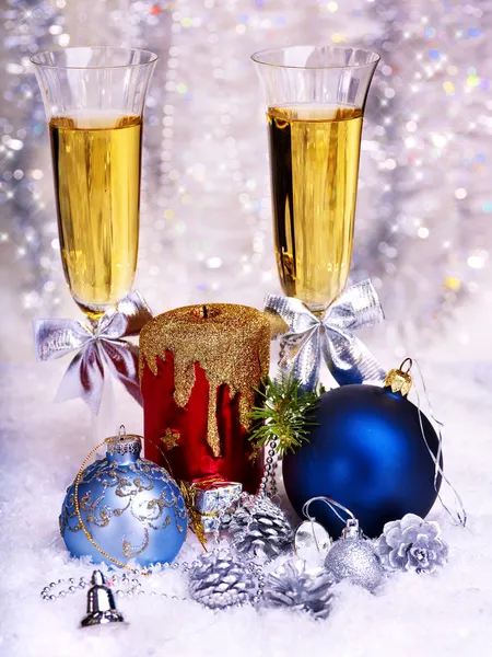 Christmas still life with champagne and candle. — Stock Photo, Image