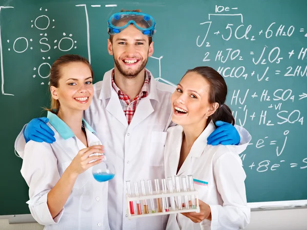 Group chemistry student with flask. — Stock Photo, Image