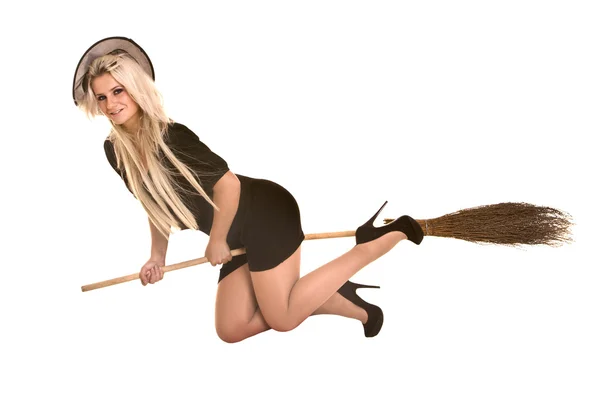 Halloween witch blond in black costume and hat fly broom. — Stock Photo, Image