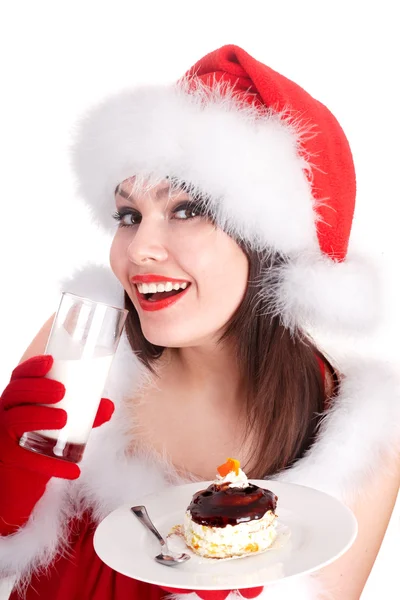 Christmas flicka i santa hatt och kaka dricka mink. — Stockfoto