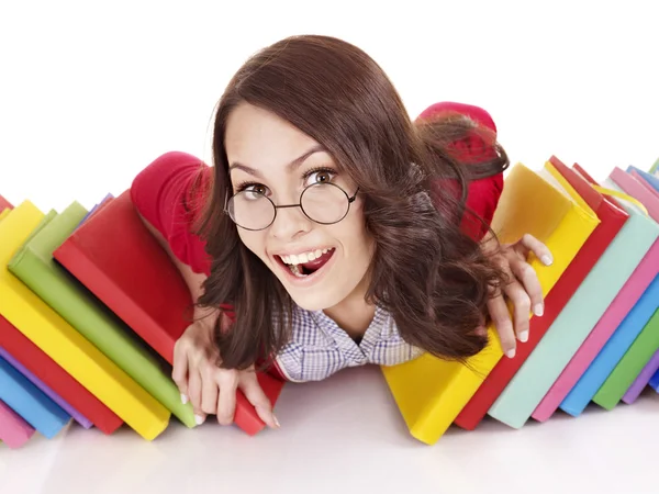 Dziewczyna w okularach z książki stosu . — Zdjęcie stockowe