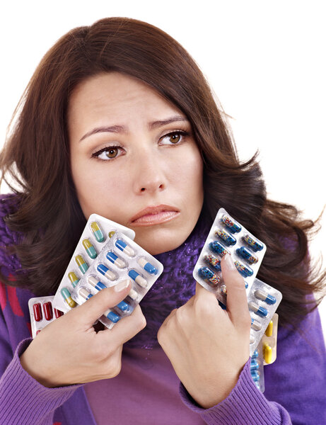Girl having flu taking pills
