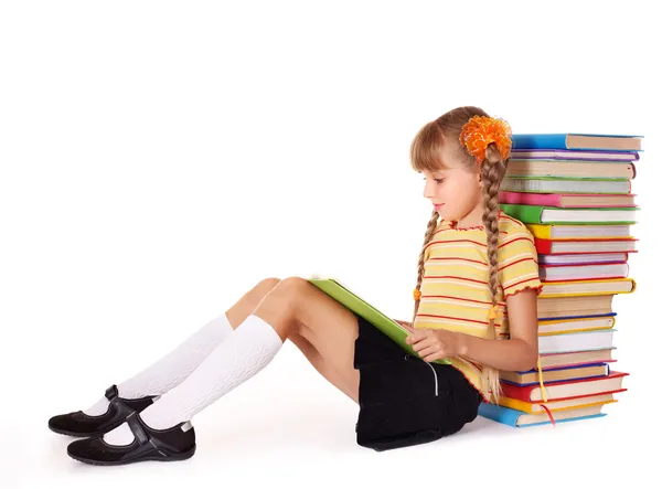 Schoolgirl sitting with pile of books. — Stock Photo, Image