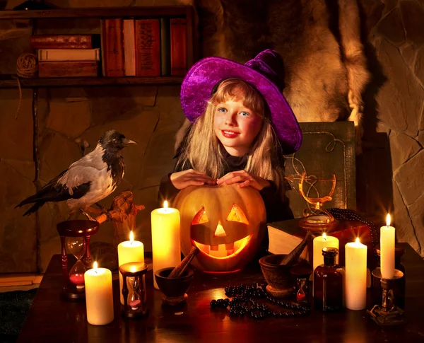 Witch with pumpkin lantern. — Stock Photo, Image