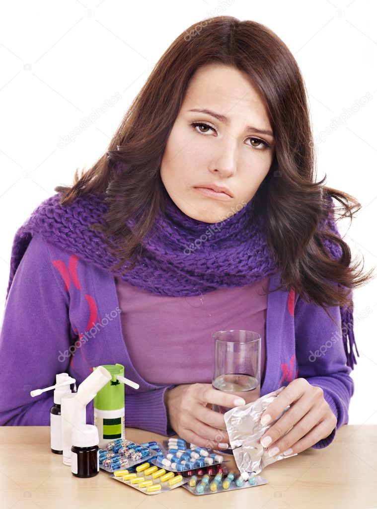 Girl having flu taking pills