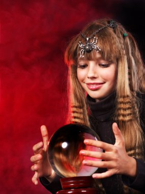 Child holding crystal ball. clipart