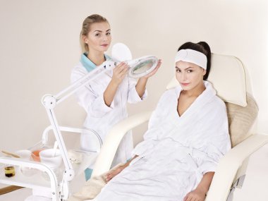 Young woman in beauty spa. clipart