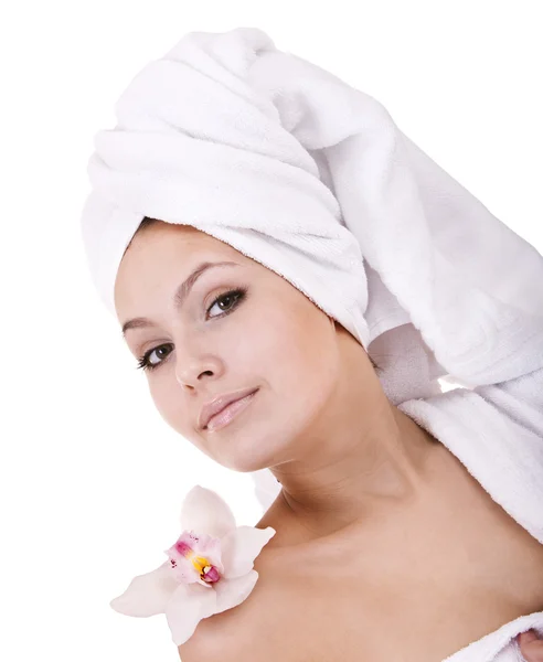 Beautiful young woman with flower in spa. — Stock Photo, Image
