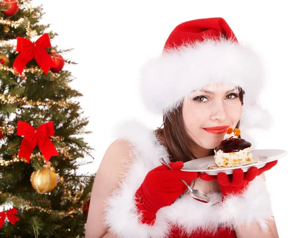 Ragazza di Natale in cappello di Babbo Natale e torta sul piatto . — Foto Stock