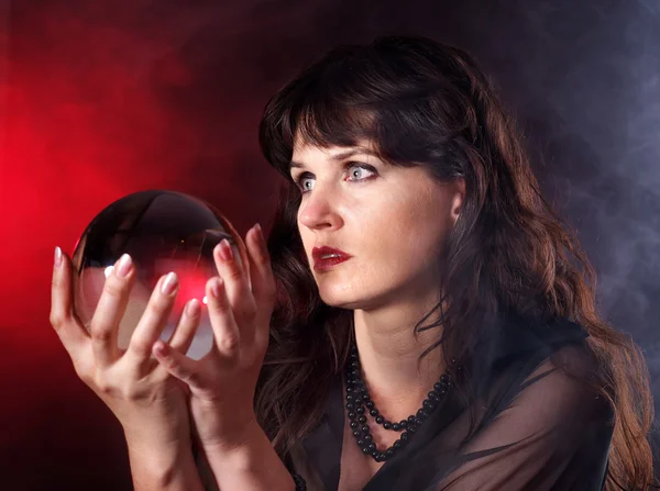 Young woman with crystal ball. — Stock Photo, Image
