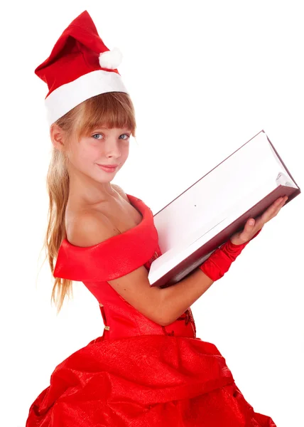 Dziecko dziewczynka w czerwonym kapeluszu santa i książki. — Zdjęcie stockowe