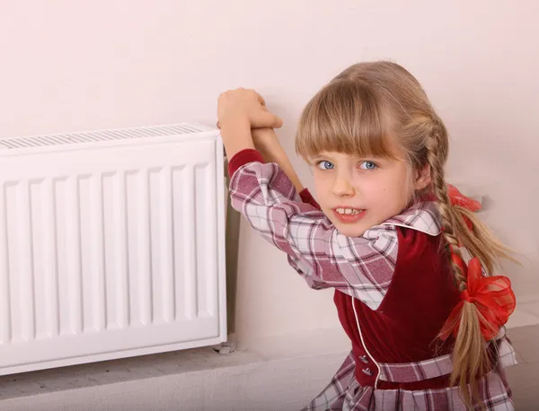 stock image Girl try open thermostat. Crisis.