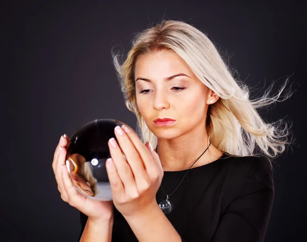Young woman with crystal ball. — Stock Photo, Image