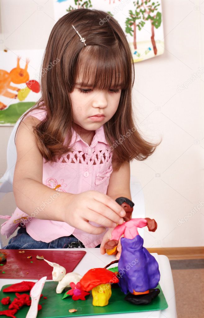 Child moulding of plasticine .