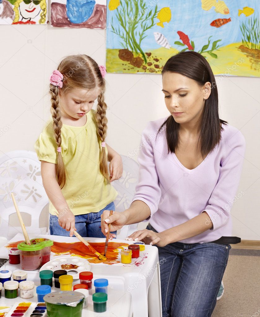 Child painting in preschool.