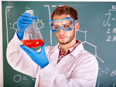 Man chemistry student with flask. clipart