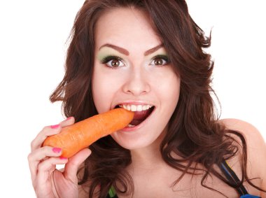 Face of girl eating carrot.