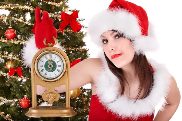 Ragazza in cappello di Babbo Natale orologio . — Foto Stock